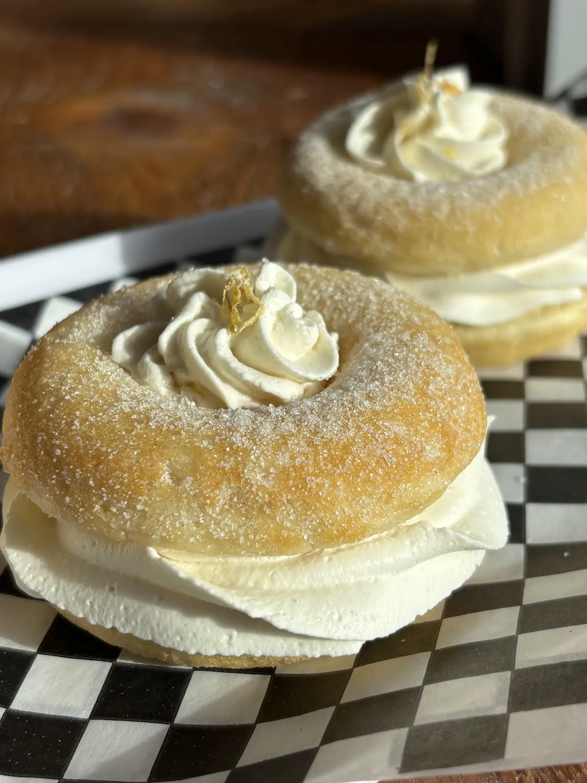 A sugar-dusted doughnut piped with cream