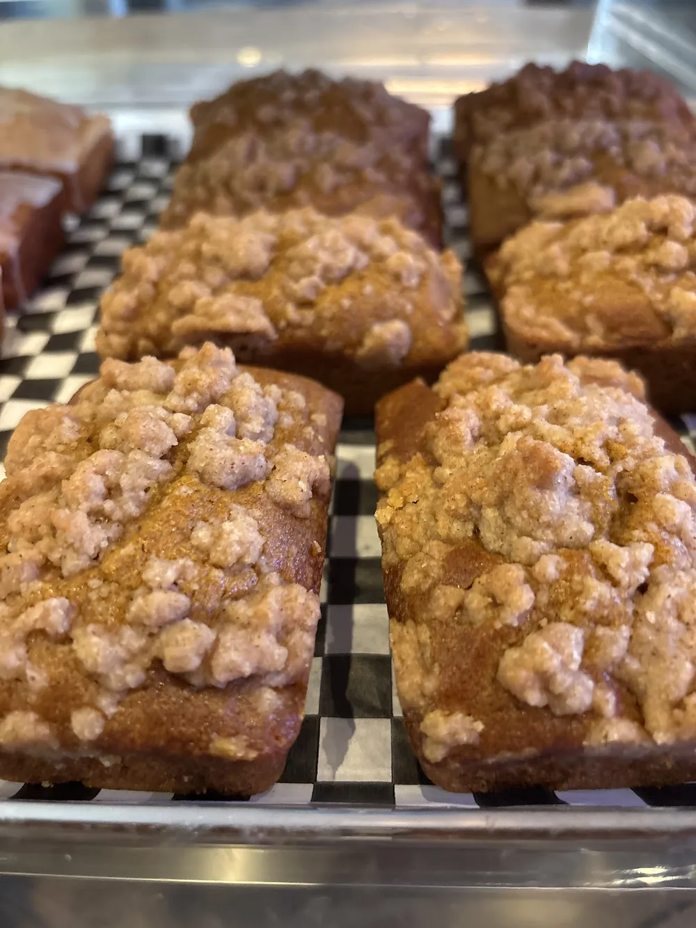 Crumble-topped loaves in the case
