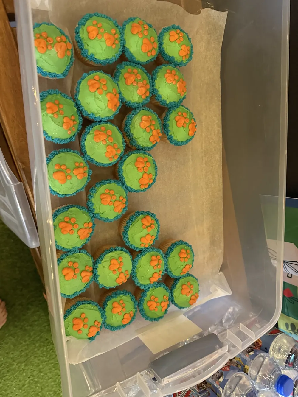 A box of green-frosted cupcakes